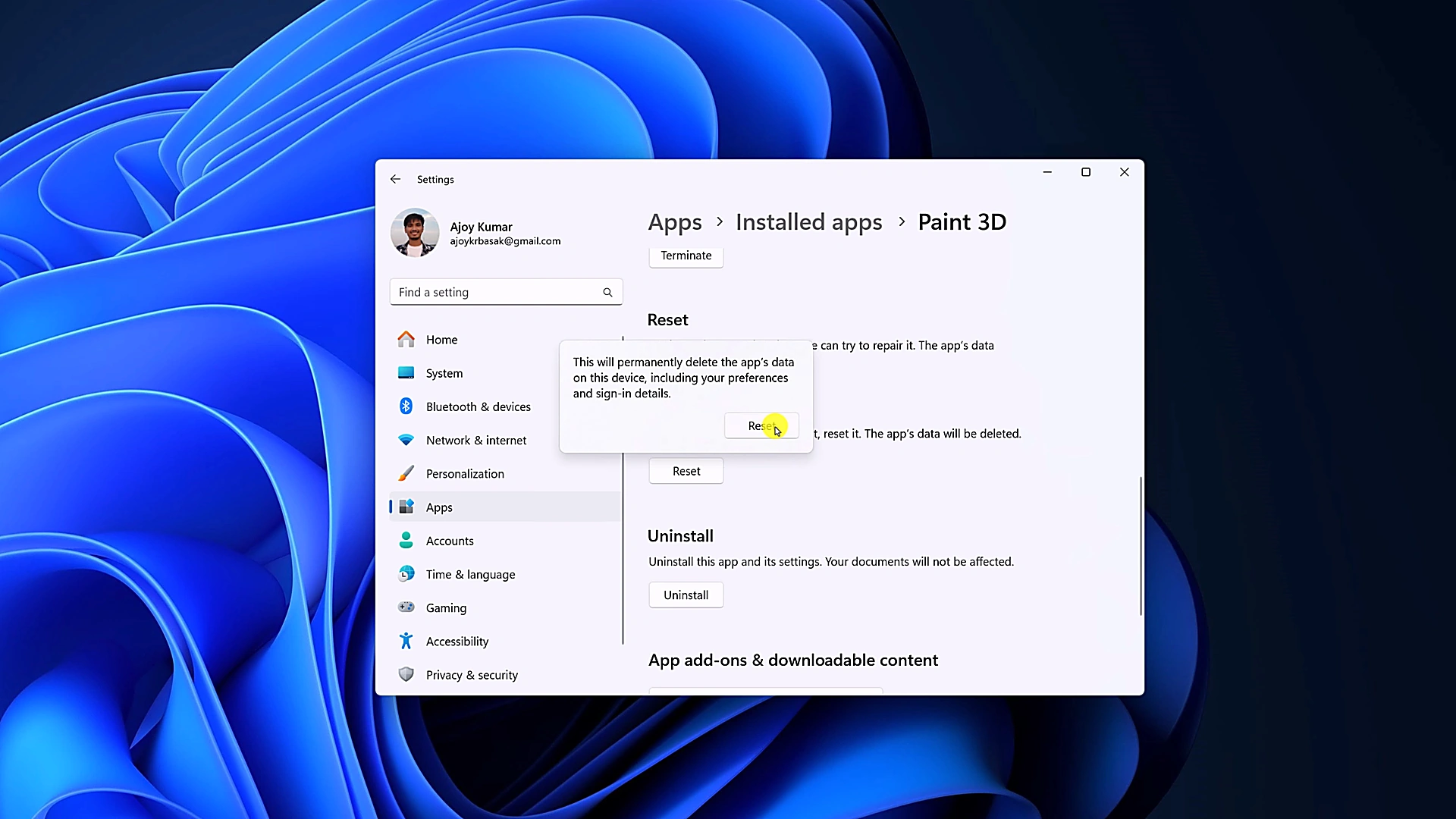 Windows 11 Settings displaying the confirmation popover warning that resetting will delete app data